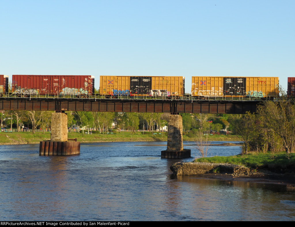 3 boxcars on the bridge